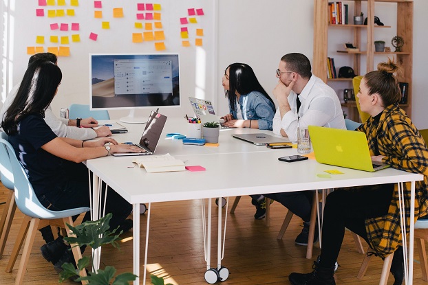 A group of people having a meeting in an office